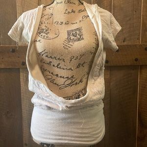 Young, fabulous & broke. Cream over shirt.